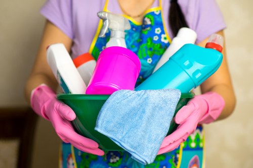 Staff following safe handling procedures during cleaning