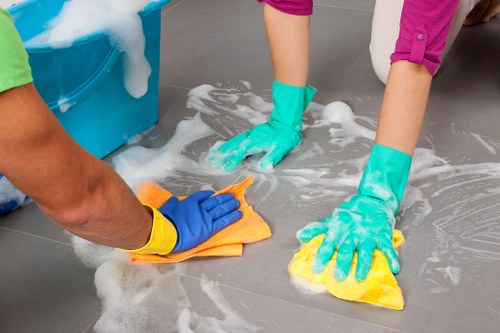 Carpet cleaning technician preparing equipment in a safe, professional environment
